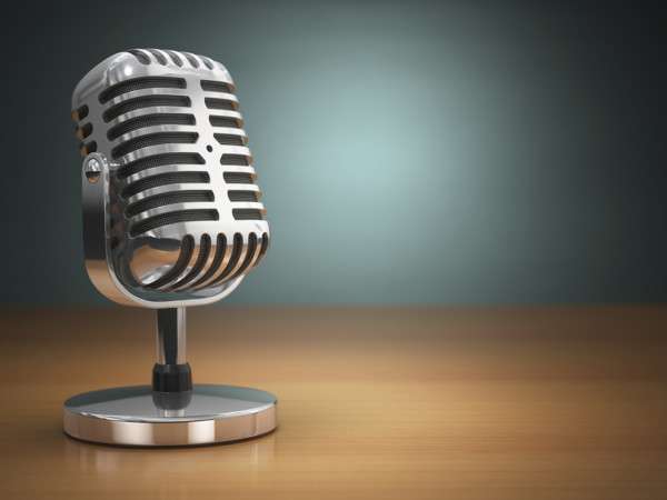 Vintage microphone on green background. Retro style.