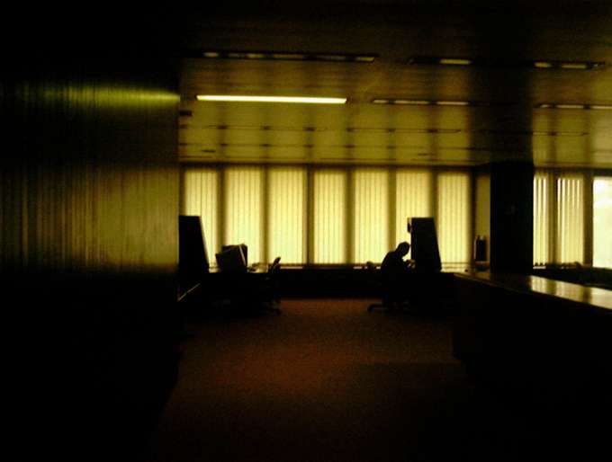 Silhouetted man in office